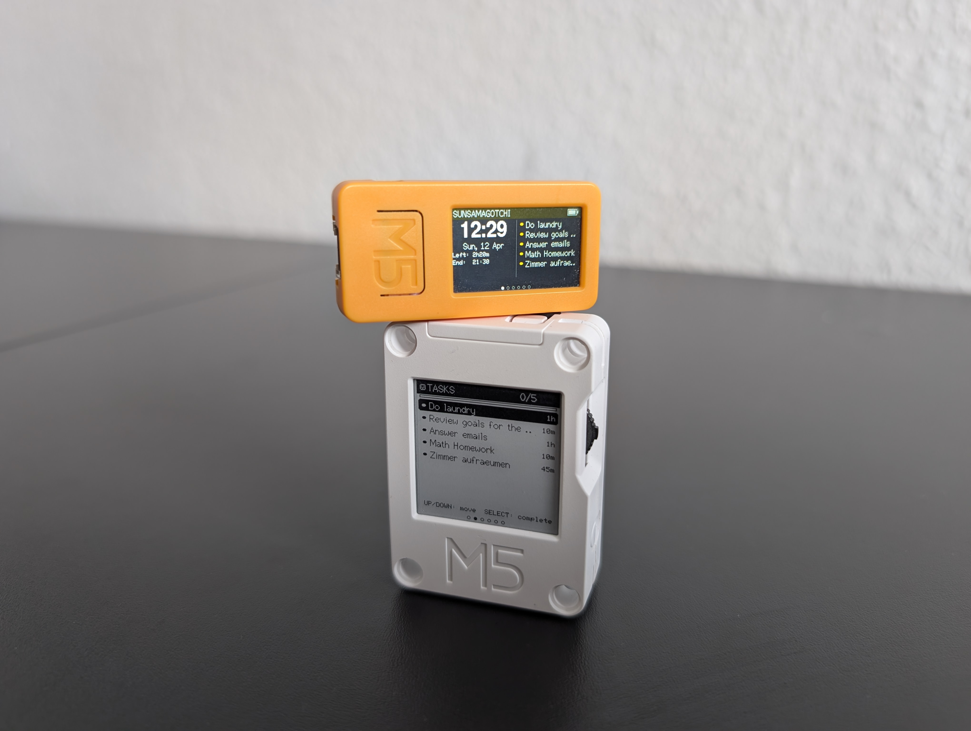 M5Stack CoreInk showing the Sunsamagotchi dashboard